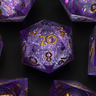 Set of purple polyhedral dice with gold numbers on a black background